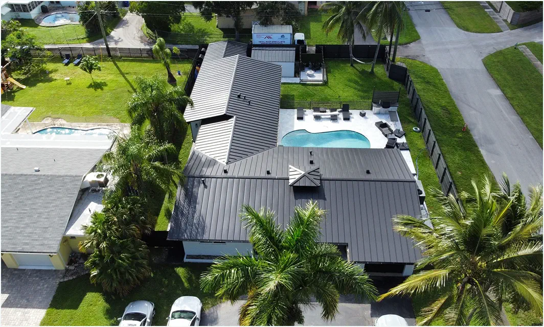 Black standing seam metal roof on a Miami home, installed by Roofing Experts Services